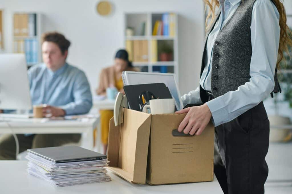 Businesswoman packing her things during move